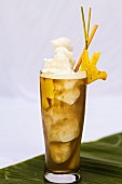 Fruity drink with ice cream and pineapple