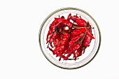 Dried red chillies in a glass bowl