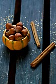 Hazelnuts and cinnamon sticks