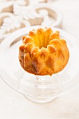 A mini Bundt cake on a cake stand