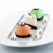 Three different petit fours with silver pearls
