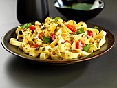 tagliatelle with coriander and chili pasta sauce and tomatoes