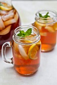 Iced Tea in Glass Mugs with Lemon and Mint