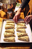 Preparing cheddar chive scones for the oven