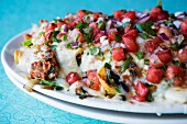 Nachos with fish and watermelon
