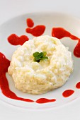 Rice pudding with strawberry coulis
