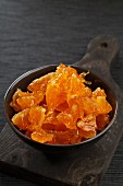 A bowl of candied orange pieces