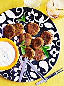 Mini falafel with a yogurt dip (seen from above)
