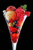 An ice cream sundae with summer fruits