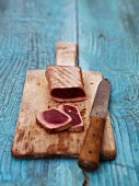 Flash-fried tuna on a wooden board