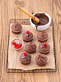 Chocolate muffins with glace cherries