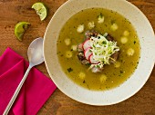 Pozole verde with cabbage and radishes (Mexico)