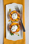 Grilled peaches topped with whipped cream