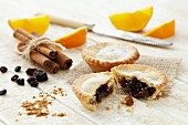 Mince pies, orange slices, cinnamon and dried fruits