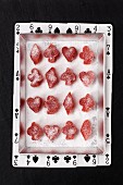 Plum fruit jellies cut into hearts, diamonds, clubs and spades shapes