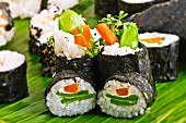 Maki sushi with mange tout, carrots and cress
