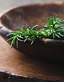 Fresh rosemary in a wooden bowl