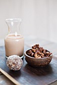 Cashew nuts with cocoa powder, almond milk and coconut and date balls