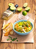 Lime soup with avocado, tomatoes, chicken and tortilla chips