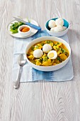 Vegetable curry with egg and rice dumplings