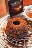 A chocolate Bundt cake dusted with cocoa powder