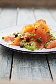 Salmon carpaccio with mustard sauce, capers and dill