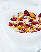 Yogurt with muesli, raspberries and fried apples