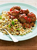 Meatballs in tomato sauce with pilau rice