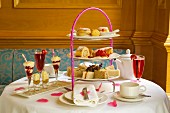 Cake, desserts, sandwiches and drinks for high tea