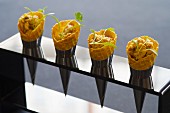 Ice cream cones filled with coronation chicken