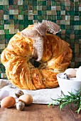 A breaad wreath with cheese and rosemary for Easter