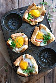 Oven-baked toast with fried eggs and cress