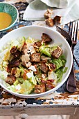 Caesar salad with bacon, croutons and Parmesan