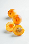 Three nectacots (a cross between an apricot and a nectarine)