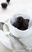 Blackberries in a dish lined with fabric