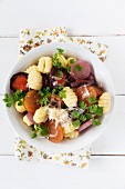 Colourful fried carrots with gnocchi