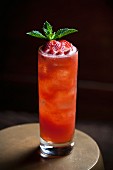 A cocktail made with strawberries, mineral water and mint