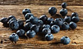 Freshly washed blueberries on a wooden surface