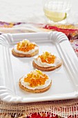 Canapés with cream cheese and caviar