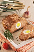 Meatloaf with egg, a slice cut