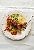 Chicken leg with couscous and Provençal vegetables