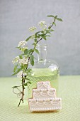 Diluted woodruff syrup and a wedding cake-shaped biscuit