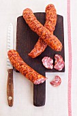 Dried Polish sausage on a chopping board