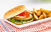 A chicken burger with potato wedges