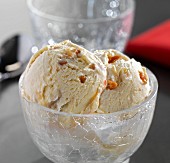 Macadamia nut ice cream in a glass bowl