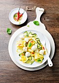 Courgette salad with mozzarella, chilli Ppeppers and basil