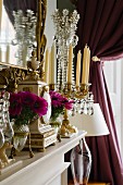 Magnificent arrangement of crystal candelabra and classic mantel clock on mantelpiece