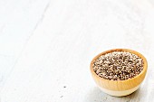 Chia seeds (salvia hispanica) in a wooden bowl
