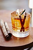 A cinnamon cocktail over ice