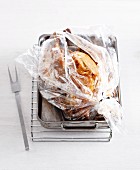 A whole turkey in a roasting bag